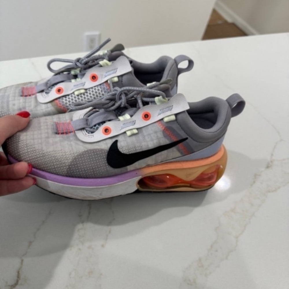 Nike Gray Sneakers with Black Swoosh and Purple & Orange Accents